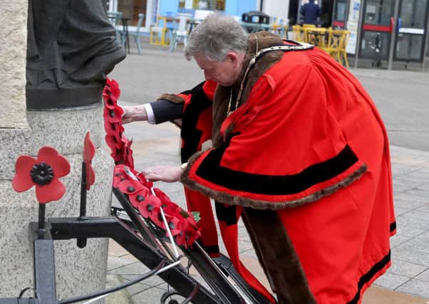 Mayor of Causeway coast and Glens Borough Council Cllr Mark Fielding lays a wreath in Coleraine on Saturday at the war memorial to mark VE day. Picture kevin McAuley/McAuley Multimedia