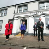 Pictured outside the old Northern Bank Building  is MEA LAG Chair, Kelli McRoberts; MEA LAG Vice Chair, Alderman Audrey Wales MBE; Portglenone Enterprise Group Director, Norman Worthington; National Lottery Heritage Fund,  Mukesh Sharma MBE; DAERA Minister, Edwin Poots and Mayor of Mid and East Antrim, Councillor Peter Johnston. The building has been converted into a community hub and office space by Portglenone Enterprise Group (PEG), which received almost £150,000 from the LEADER element of the Northern Ireland Rural Development Programme. Photo Kelvin Boyes/PressEye