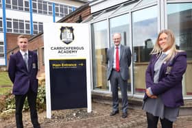 Carrickfergus Academy students Lucas Todd and Enya Clarke with Education Minister, Peter Weir.