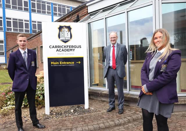Carrickfergus Academy students Lucas Todd and Enya Clarke with Education Minister, Peter Weir.