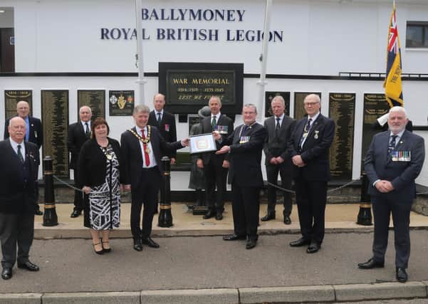 Members of Ballymoney Royal British Legion receive a framed Coat of Arms from the Mayor of Causeway Coast and Glens Borough Council Alderman Mark Fielding and Mayoress Mrs Phyliss Fielding in recognition of its receipt of the Queen’s Award for Voluntary Service