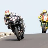 Alastair Seeley (Relentless Suzuki) leads Stuart Easton (Swan Honda) and John McGuinness (HM Plant Honda) over Black Hill on his way to victory in the feature race at the North West 200 in 2010.