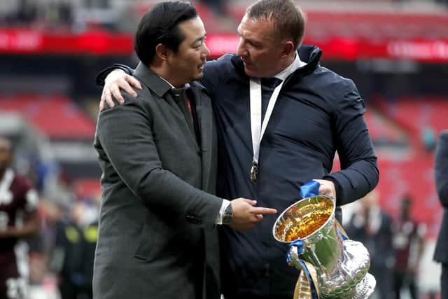 Leicester City manager Brendan Rodgers (right) and Chairman Khun Aiyawatt Srivaddhanaprabha with the trophy after the Emirates FA Cup Final at Wembley Stadium, London. Picture date: Saturday May 15, 2021.