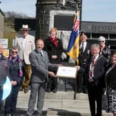 Members of Bushmills Royal British Legion receive a framed centenary certificate from the Mayor of Causeway Coast and Glens Borough Council Alderman Mark Fielding and Mayoress Mrs Phyliss Fielding