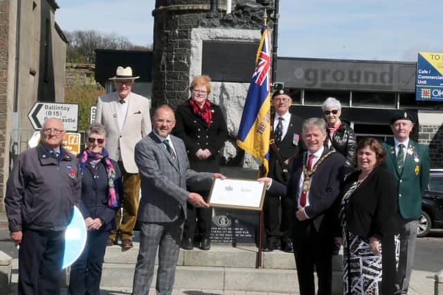 Members of Bushmills Royal British Legion receive a framed centenary certificate from the Mayor of Causeway Coast and Glens Borough Council Alderman Mark Fielding and Mayoress Mrs Phyliss Fielding