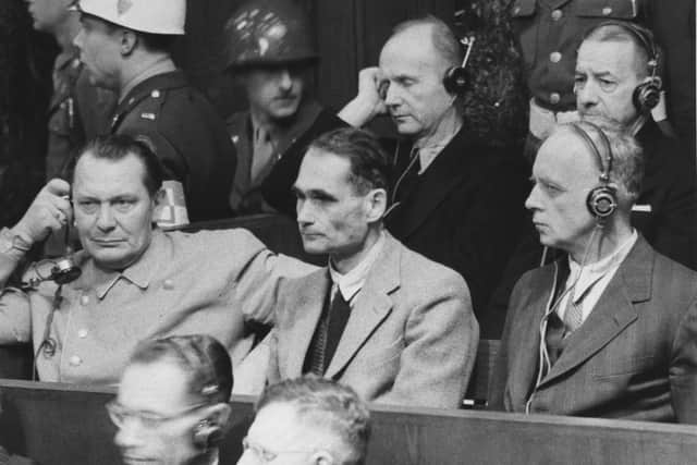 From left to right, Hermann Goering, Rudolf Hess, and Joachim von Ribbentrop face justice at the Nuremberg Trials following World War II, circa 1946. (Photo by Central Press/Hulton Archive/Getty Images)
