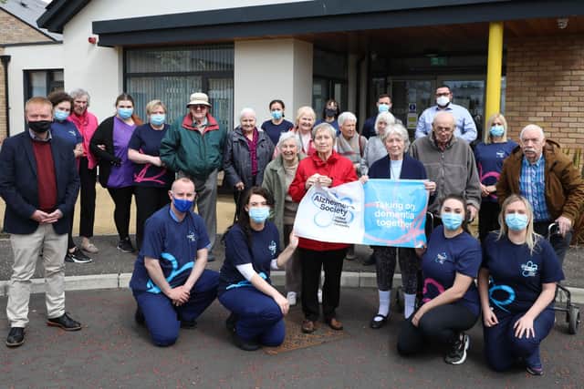 Andy Mayhew (far left),  Praxis Care chief executive, with tenants and support staff before the walk. Photo by PressEye
