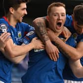 Shayne Lavery (centre) grabbed the Irish Cup final spotlight by breaking the deadlock in Lurgan for Linfield over Larne. Pic by Pacemaker.