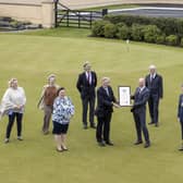 Pictured at Royal Portrush Golf which received the Freedom of the Borough from Causeway Coast and Glens Borough Council on May 21 are front (left-right), Mayoress Mrs Phyliss Fielding, David McCorkell, Lord Lieutenant for County Antrim, Dr Ian Kerr, Captain and the Mayor of Causeway Coast and Glens Borough Council Alderman Mark Fielding. Back row (left-right), Nicky Smith, Captain of the Ladies branch, Kath Stewart-Moore, President of the Ladies branch, Robert Barry, immediate past Captain, David McMullan, Honorary Secretary, Sir Richard McLaughlin, President and John Lawlor General Manager.Picture Steven McAuley/McAuley Multimedia