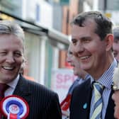 Former DUP leader Peter Robinson (left) said leader elect Edwin Poots (right) ‘will not unite unionism if he cannot unite his own party’. 
The two men are seen here together on the election trail in Lisburn in 2011. Photo: Presseye.com.