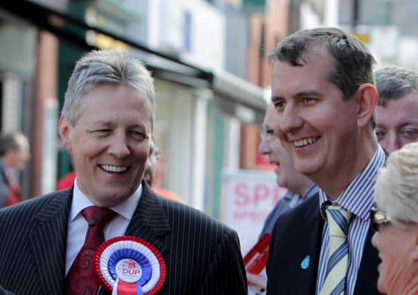 Former DUP leader Peter Robinson (left) said leader elect Edwin Poots (right) ‘will not unite unionism if he cannot unite his own party’. 
The two men are seen here together on the election trail in Lisburn in 2011. Photo: Presseye.com.