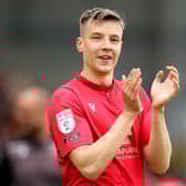 Brad Lyons celebrates as Morecambe secure a play-off final spot