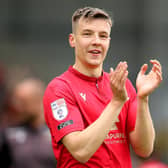 Brad Lyons celebrates as Morecambe secure a play-off final spot