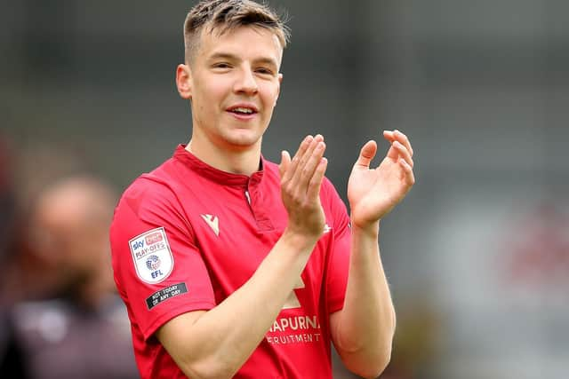 Brad Lyons celebrates as Morecambe secure a play-off final spot