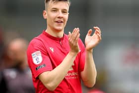 Brad Lyons celebrates as Morecambe secure a play-off final spot