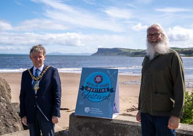 The Mayor of Causeway Coast and Glens Borough Council Alderman Mark Fielding pictured in Ballycastle ahead of the virtual Rathlin Sound Maritime Festival with Philip Robinson from Giant Tour