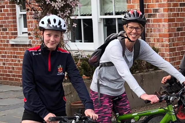 Dr McKelvey and her daughter Anna cycling to Uganda