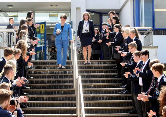 Press Eye - Belfast - Northern Ireland - 25th May 2021
Photo by William Cherry / Press Eye
First Minister Arlene Foster visited Craigavon Senior High School today to mark the school's celebrations for the NI Centenary. During the visit, she met pupils and teachers, and took part in a tree planting ceremony to commemorate the occasion.
25 May 2021
Foster joins students in celebration of best of Northern Ireland
First Minister Arlene Foster has visited a special exhibition of favourite memories and much-loved locations created by students at Craigavon Senior High School as part of their Centenary celebrations.
The First Minister commended the inspirational display of images and prose which celebrate the best of Northern Ireland.
Arlene Foster said: "I was delighted to meet with students and hear from them about what matters most to them. It is clear that they have a love and a passion for this place that I share. The only point of difference between us is whether Fermanagh's lakes or Armagh's orch