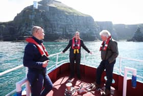 Minister Edwin Poots with Chief Fisheries Officer Mark McCaughan and Principal Scientific Officer Colin Armstrong viewing the thousands of seabirds comprising razor-bills, guillemots, fulmars, kittiwakes and puffins