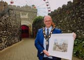 Cllr Jim Montgomery with a painting of the Barbican Gate by his former school teacher, Mr Harry Boyd which he is contributing to the Centenary Collections project.