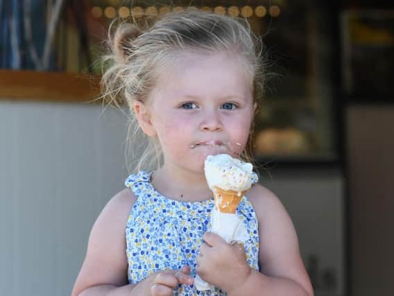 Young Grace Wall enjoys an ice cream in the hot weather. Pic Colm Lenaghan/Pacemaker