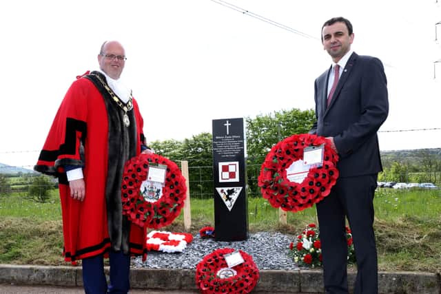 Cllr Jim Miontgomery and Pawel Majewski, Consul General of the Republic of Poland pictured at the memorial site.