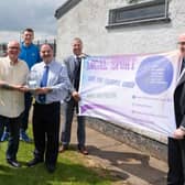 Cllr Norrie Ramsey presented Grange Rangers chairman Ivan Higgins with a trophy to celebrate the Ballyclare club's 50th anniversary. They are pictured alongside Paul Girvan MP, Steve Aiken MLA, Gary Stitt (Antrim and Newtownabbey Sports Forum) and former Nottingham Forest coach Michael Whitley. Pic by Dave Pettard.