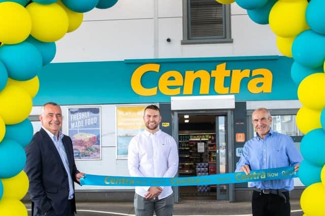 At the opening of Lusty's Centra Larne Port are Trevor Magill, Musgrave managing director,  and store owners Raymond and Richard Lusty.