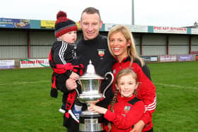 Stuart King pictured with his family after winning the Bob Radcliffe Cup during his time at Banbridge Town
