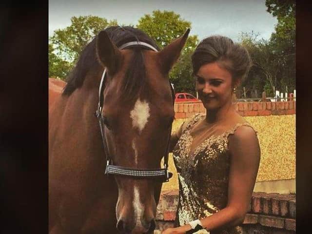 Angie with one of her horses.