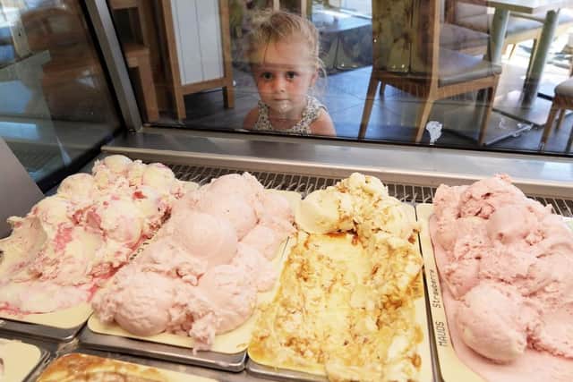 Young Grace Wall enjoys a ice cream at Cafe Mauds. Pic Colm Lenaghan/Pacemaker