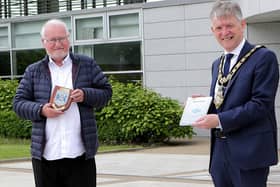 Douglas McClarty, author of Plastic Sandals, pictured with the Mayor of Causeway Coast and Glens Borough Council Alderman Mark Fielding
