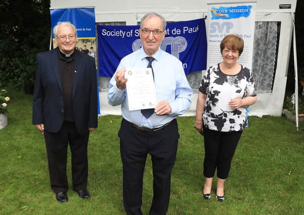 Brian McLaughlin from St Patrick’s SVP Conference in Portrush is pictured with Fr Perry Gildea, SVP Spiritual Advisor, and Mary Waide, Regional President of SVP North Region, at St Vincent de Paul garden party to celebrate Volunteers' Week and those who have devoted more than 30 years service to the Society
