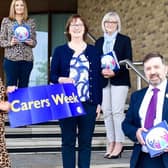 Health Minister Robin Swann pictured with Mandy Gourley, Mari McLaughlin, Winona Wilson, Jennifer Welsh, Chief Executive, Northern Trust and Claire Campbell, Carers Co-ordinator, NHSCT