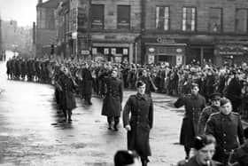 Members of Lancaster's Home Guard parade past the Town Hall in Dalton Square in 1944. Picture: JPIMedia Archives
