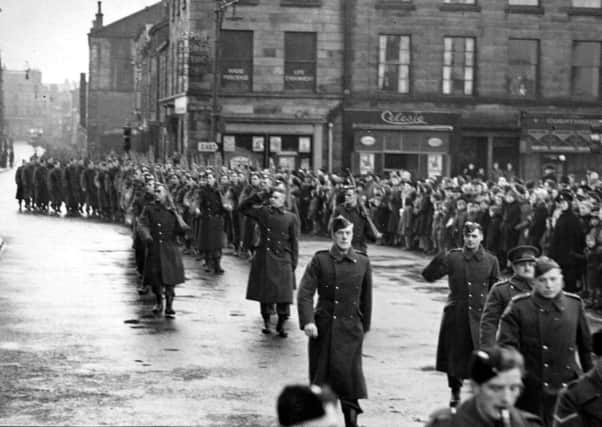 Members of Lancaster's Home Guard parade past the Town Hall in Dalton Square in 1944. Picture: JPIMedia Archives