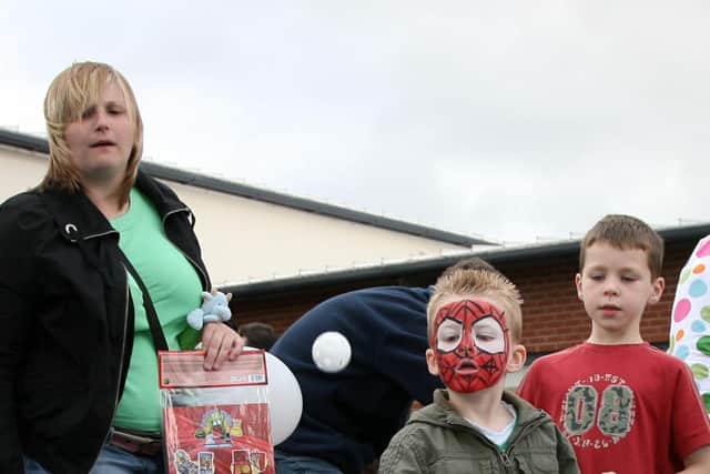 Jay Carson shoots for the target at the Camphill Primary School Summer Fair as mum Ashley looks on. BT26-128JC