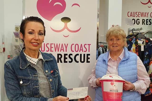 Local businesswoman Thelma Smyton seen here donating a cheque for £800 to the Chair of Causeway Coast Dog Rescue Ltd, Margaret Dimsdale-Bobby after completing a competition to raise funds for two local charities