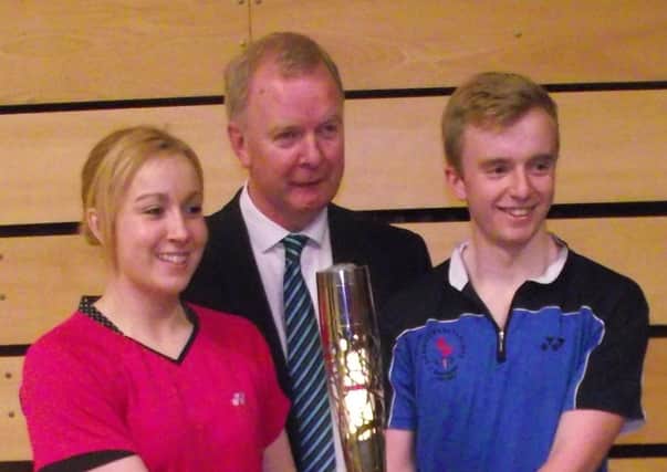 Sinead Chambers with dad Brian and brother Ciaran as they get their hands on the Commonwealth Games baton