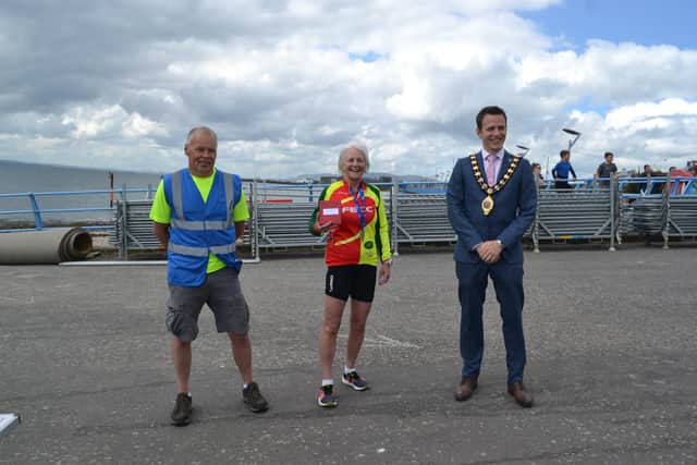 Stephine Lloyd, 60-69 years old age group winner, with organiser Gary Davison and Cllr Peter Johnston.