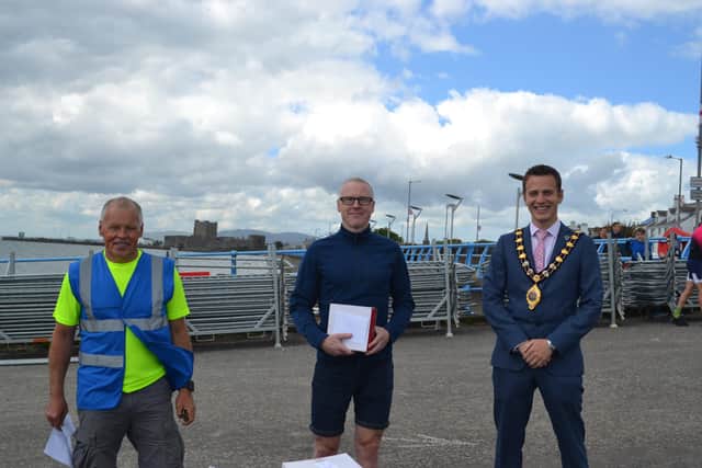Alister Duffield, winner of the male Sprint event, with former Mayor, Cllr Peter Johnston and Gary Davison, organiser.