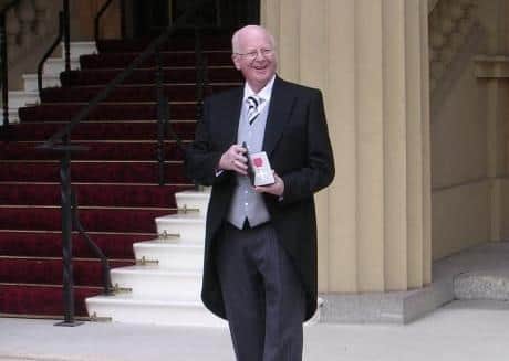 Alderman Tommy Nicholl pictured in 2006 at Buckingham Palace after being awarded the MBE. Ald Nicholl was presented with a special tribute recently to mark 40 years as a councillor in the Bannside area.