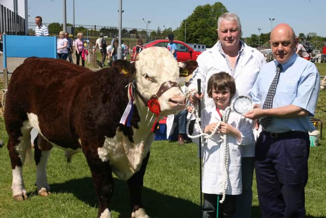 Champion Hereford went to James and Bradley Graham making th epresentation Basil Bailey from Thompsons who sponsored the event. Pic Kevin McAuley