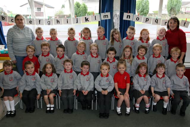 Miss K. McCartney and Mrs. C. McCavana pictured with Carniny Primary School's P-1 class. BT39-021JM.