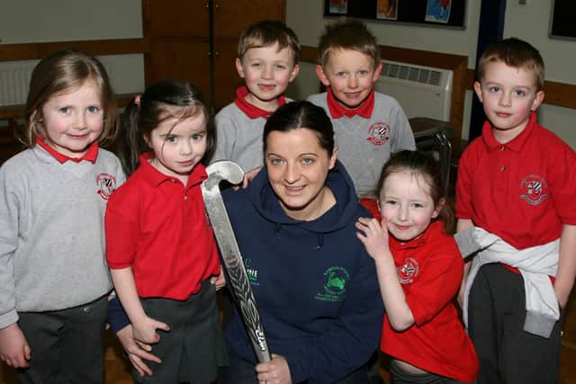 Carniny Primary School teacher Louise Creighton, who is a member of the Randlastown Ladies Hockey team, is seen here with pupils from the school before setting off to take part in a charity penalty shoot-out against members of the Belfast Giants at Junction One, which raised funds for Marie Curie Cancer Care. Included are Lydia Manson, Zamara Nicholl, Steel Mercer, Ben Piper, Charlotte Rodgers and Jay Smyth. BT12-128JC