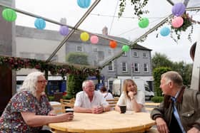 Cllr Hazel Legge (Development Committee Vice-Chair) with Geordie Law; Ald Amanda Grehan (Development Committee Chair) and Regg Frazer enjoying a coffee in Lisburn’s alfresco parklet