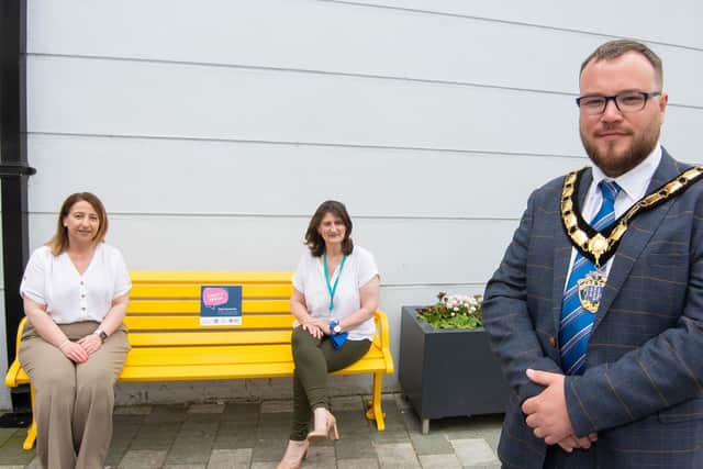 Deputy Mayor Councillor Matthew Armstrongwith Emma McCrea of Ballymena BID and Yvonne Carson of the Northern Trust at the new Chatty Bench in Wellington Court, Ballymena.