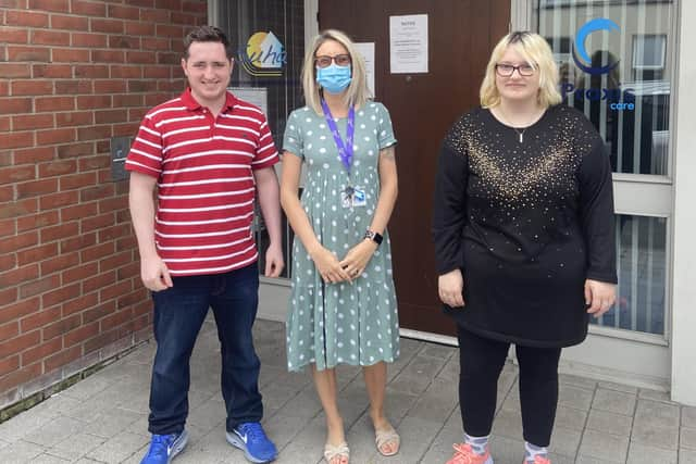 Residents of Locke House, Emmett McKay  and Natasha Stitt with the Acting Manager Christine Bracewell (centre).