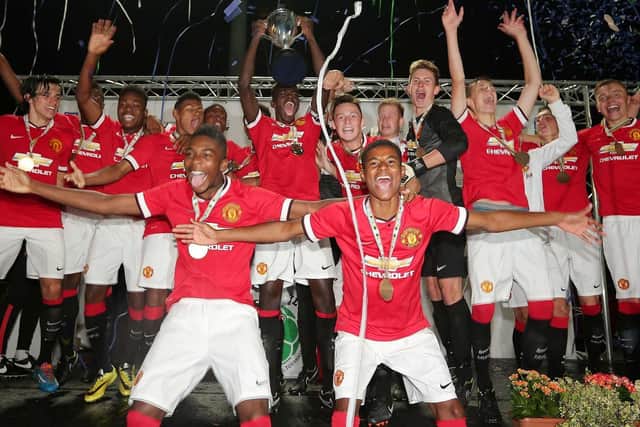 Manchester United celebrate winning 2014 Premier Section trophy