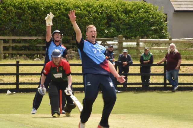 Newbuildings' Ross Dougherty along with wicket-keeper Gareth McKeegan appeal for LBW, during their game against Ballyspallen. Picture by Lawrence Moore